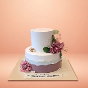 a cake with flowers on itCustom wedding cakes Chennai, Best anniversary cake in Chennai, Cake Square Chennai, Two-layer cake for anniversary, Romantic anniversary cake, 45 minutes cake delivery in Chennai, Eggless anniversary cake Chennai