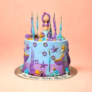 Blue mermaid theme cake, Mermaid birthday cake for girls,Blue theme birthday cake for kids, Custom mermaid cake Chennai, Underwater theme cake for birthday, Mermaid tail birthday cake, Ocean theme birthday cake for girls, First birthday mermaid cake, Designer mermaid cake near me, Girls birthday cake online, Mermaid cake for 5-year-old, Mermaid theme cakes in Chennai, Cute mermaid birthday cake, Buy mermaid cake online Chennai, Mermaid cakes with shells and pearls, Fantasy theme birthday cakes for girls, Order custom birthday cakes Chennai, Best birthday cake shop for kids in Chennai, Cakes for kids birthday in Chennai, Kids birthday cake home delivery Chennai, Top customised cake shops in Chennai, Biirthday cake for baby girl, cake square