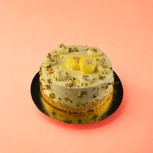 Lemon cake with nuts, cream, and yellow decorations for celebration in Chennai.