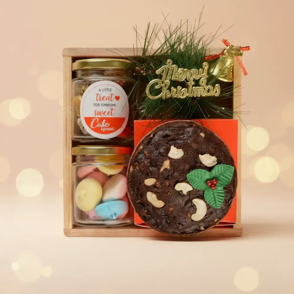Rich Christmas Plum Cake Gift Box @699 Plum cake 250 gms, Macaroons 100 gms, Chocolate 100 gms, Vanilla muffin, Chocolate muffin