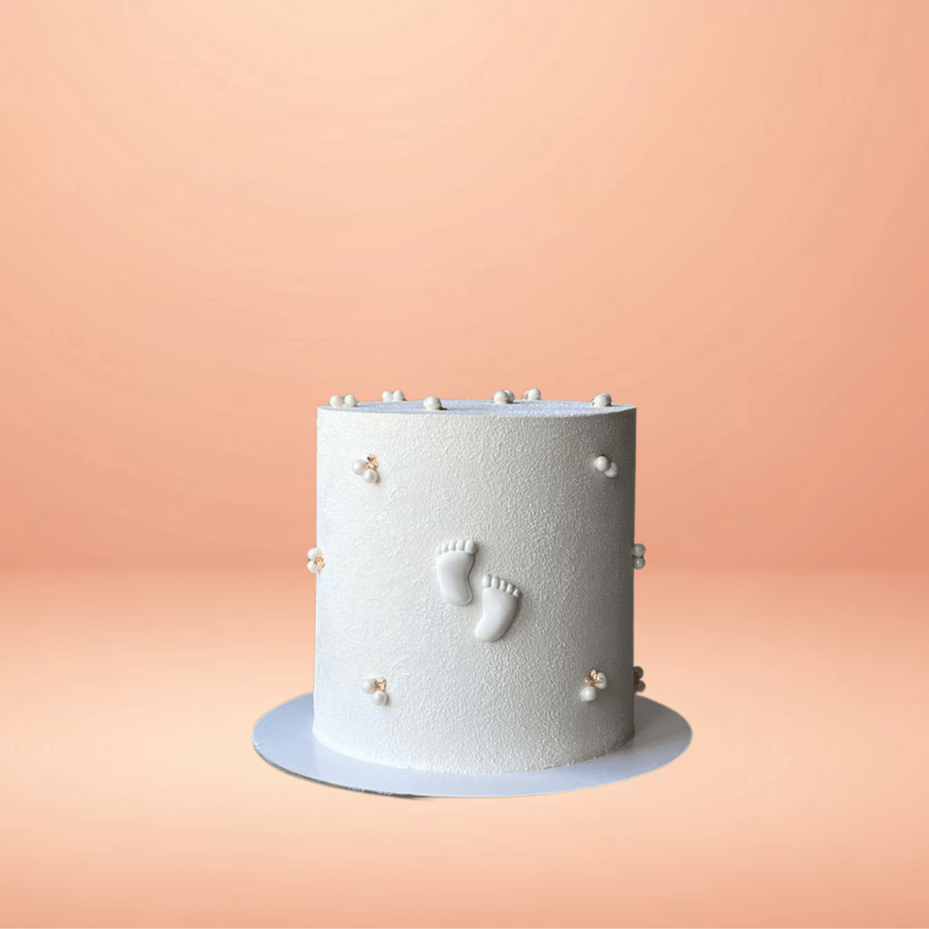 kids foot customised cakes in chennai, cakes in chennai, kids birthday single tier, meaningful first birthday cake design, best customised cakes in chennai, cakes in chennai, kids birthday cakes, cakes for kids, white theme kids birthday cake, kids birthday cake ideas, kids birthday design ideas, unique designs, best customised cakes in chennai