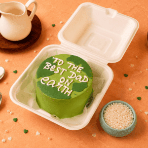 Green cake with 'To the best dad on Earth' message in white icing, Chennai. best dad on earth bento cake, best dad cake, father's day bento cake, fathers day cake chennai, cake for dad, personalized fathers day cake, dad birthday cake, customized cake for father, best dad ever cake, korean bento cake chennai, mini cake for dad, fathers day gift cake, happy fathers day cake, aesthetic bento cake, same day cake delivery chennai, cake square fathers day cakes, premium fathers day cake, cute cake for dad, fathers day surprise cake, best bento cakes in chennai.