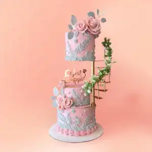 Three tier pink floral wedding reception cake in Chennai with sugar roses, hand piped lace panels and a spiral staircase, also made as an engagement cake by Cake Square.