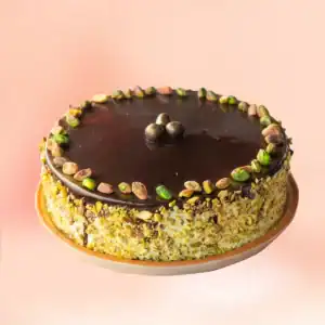 Chocolate pistachio cake in Chennai with a glossy dark chocolate top, whole pistachios and sides fully coated in crushed pistachio, delivered in 45 minutes by Cake Square.