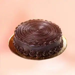 Chocolate truffle cake in Chennai with dark chocolate ganache swirled on top, rosette piping around the base and chocolate curls, delivered in 45 minutes by Cake Square.