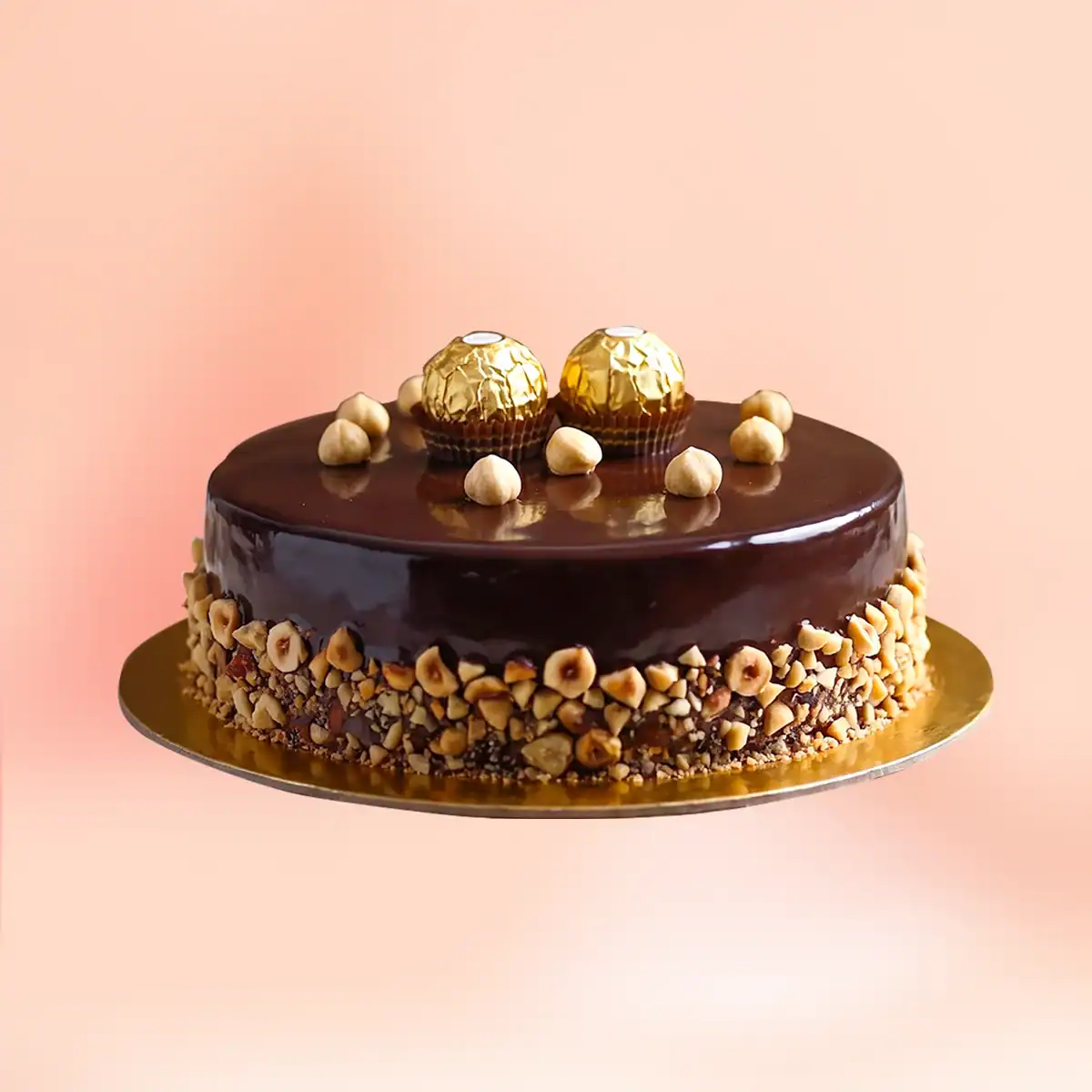 Ferrero Rocher chocolate cake in Chennai with a dark chocolate mirror glaze, whole hazelnuts and Ferrero Rocher chocolates on top, delivered in 45 minutes by Cake Square.