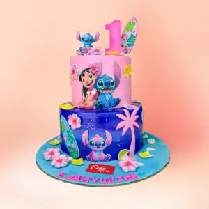 Two tier Lilo and Stitch theme birthday cake in Chennai with a pink and purple beach design, cartoon character panels and a custom name and number one topper from Cake Square.