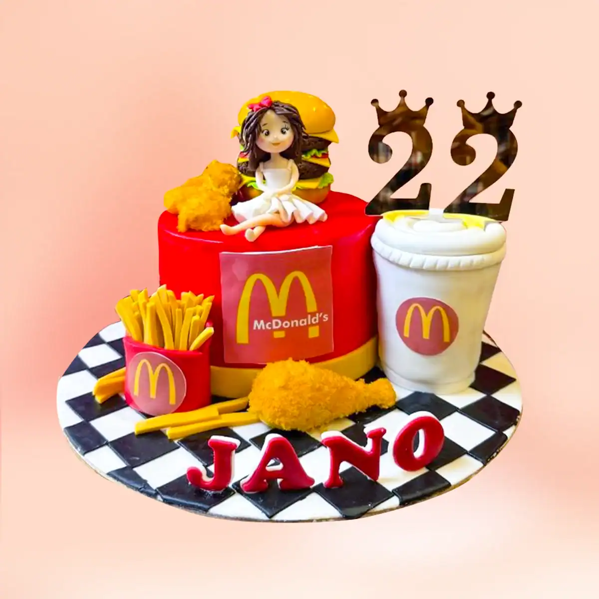 McDonald's fast food theme birthday cake in Chennai with a burger box figure, fries carton, drink cup and a checkered board with a custom age topper from Cake Square.