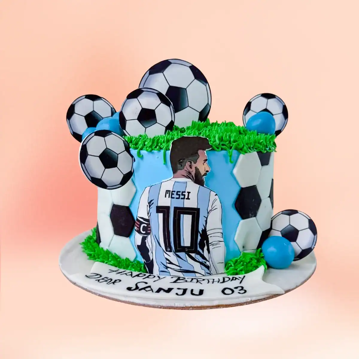 Messi football theme birthday cake in Chennai with a sky blue Argentina number ten jersey panel, soccer ball toppers and green grass texture from Cake Square.