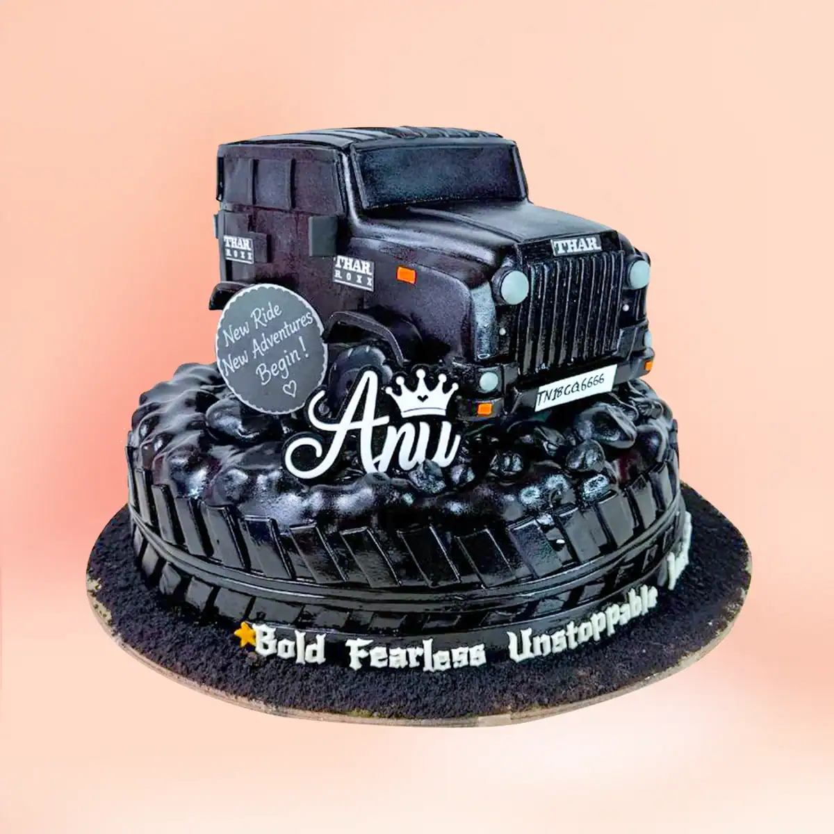 Thar SUV jeep theme birthday cake in Chennai, a fully sculpted black jeep with grille and headlights on a tyre tread base with custom lettering from Cake Square.